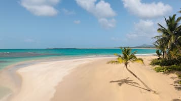 On the beach, sun-loungers, beach umbrellas, beach towels