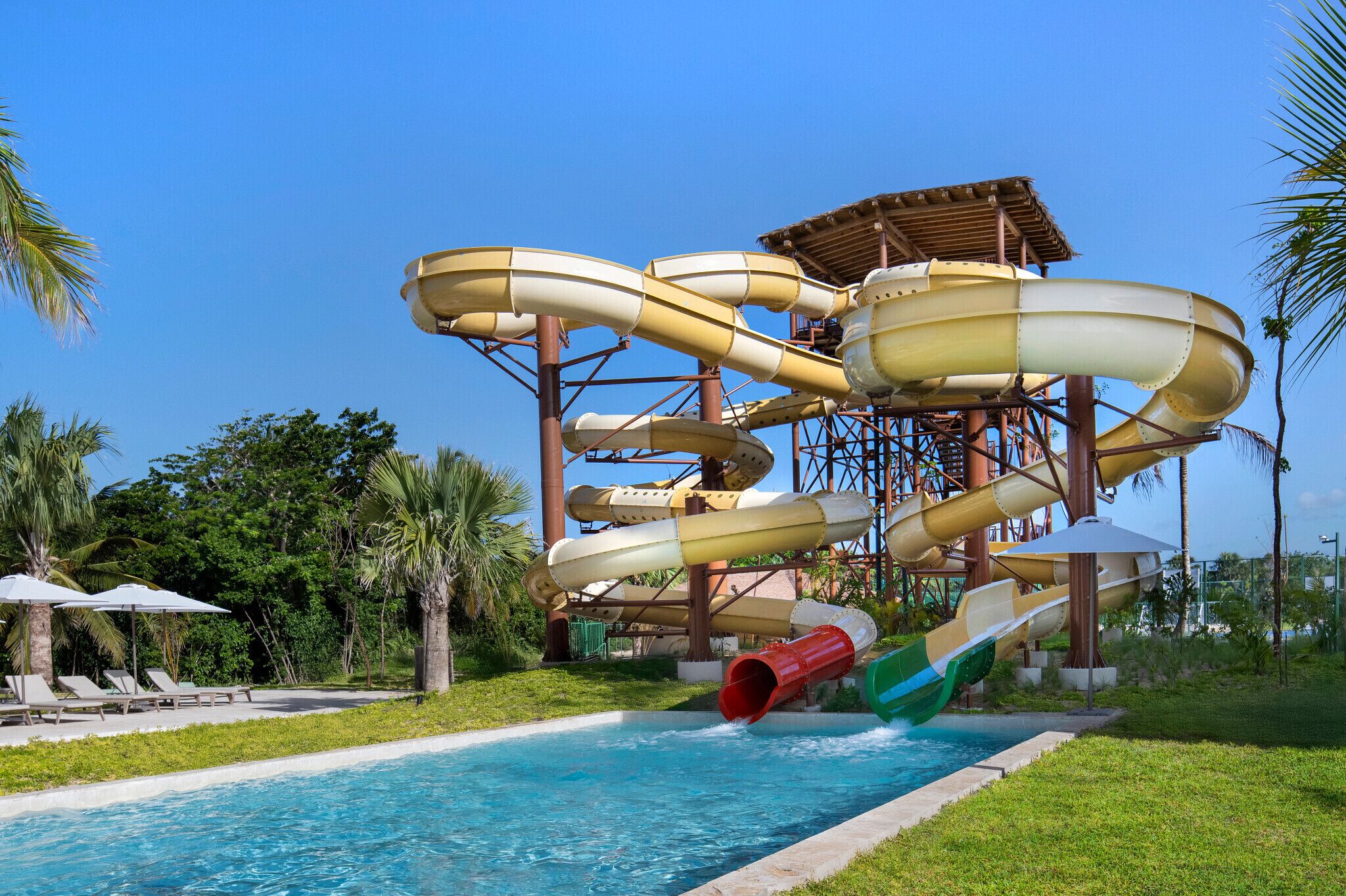 A water park with multiple slides and a pool.