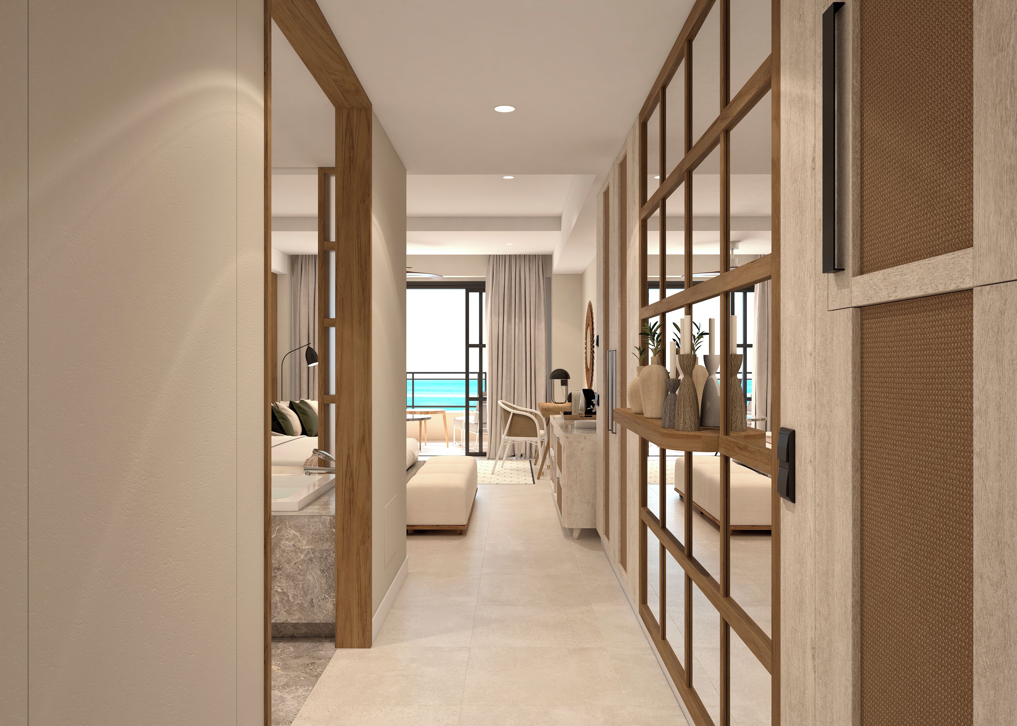 A modern hotel room with a balcony, a seating area, and a view of the ocean.