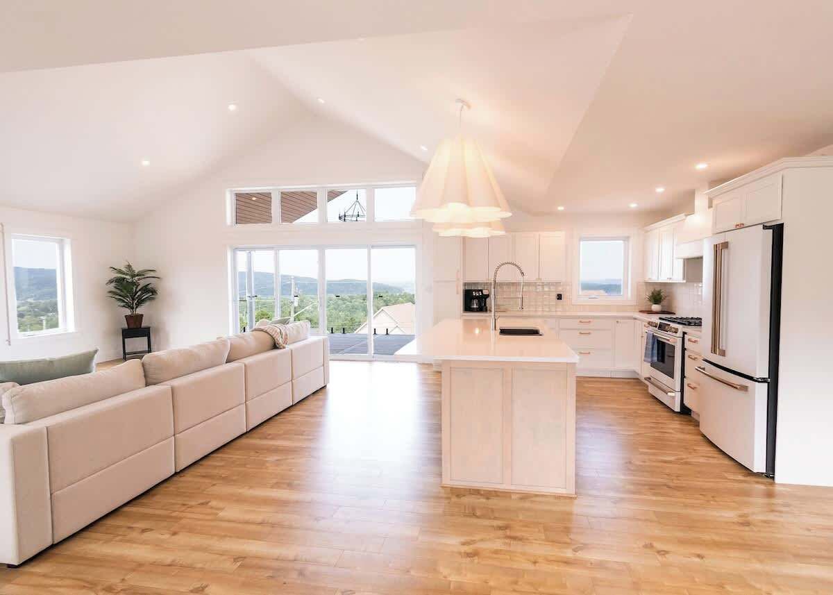 Large, fully equipped kitchen. Don't miss mingling with your guests with this open concept kitchen and living room!