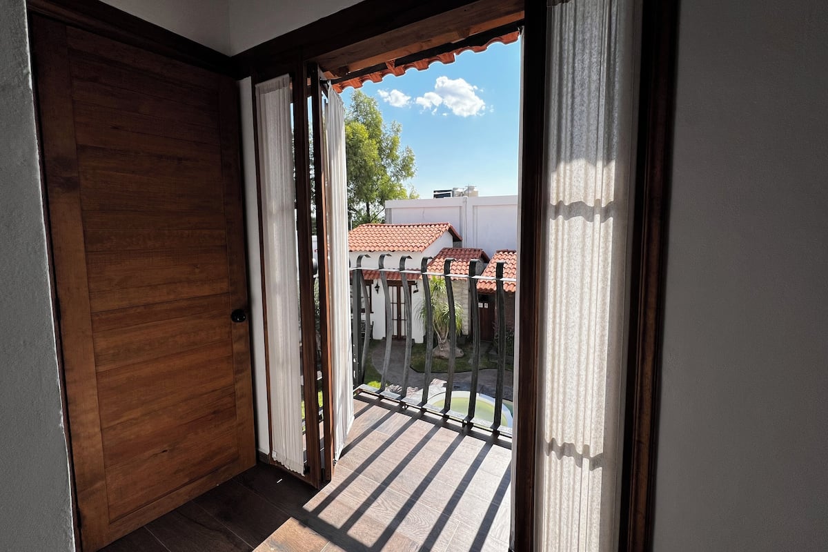 Grand Double Room, Pool View | Free minibar items, iron/ironing board, free cribs/infant beds
