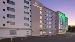 A multi-story hotel with a prominent 'element by Westin' sign, featuring a modern facade with large windows and a parking lot in front. - Element by Marriott Savannah Midtown (Savannah)