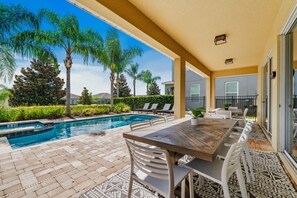 Outdoor dining - 5BR Themed Villa • Theatre Room • Near Disney (Kissimmee)