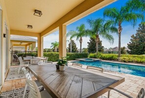 Outdoor dining - 5BR Themed Villa • Theatre Room • Near Disney (Kissimmee)