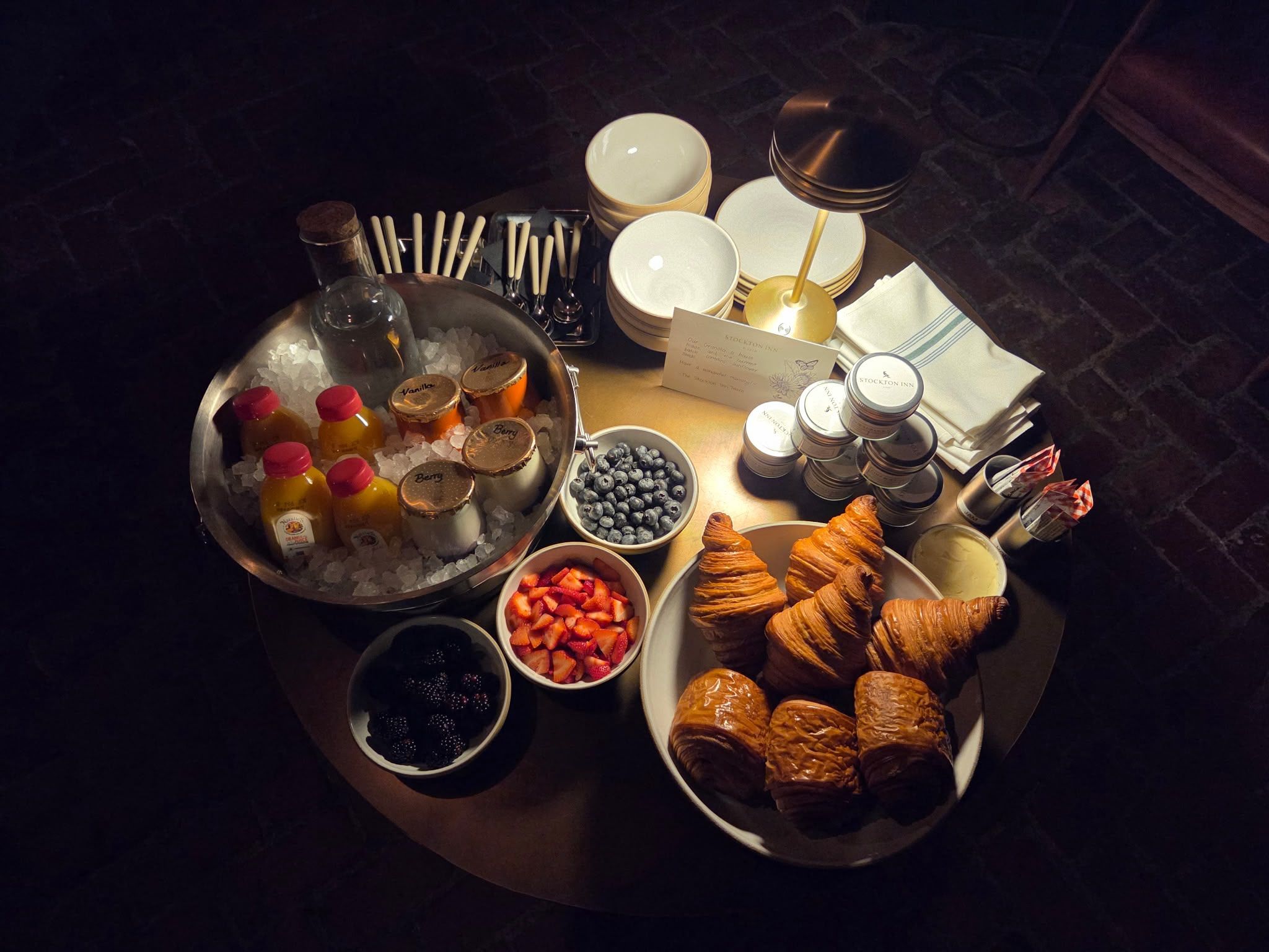 A breakfast spread with various food items and condiments.