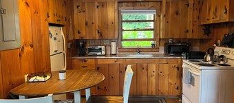 Charming lakefront 2-bedroom cottage with private beach & dock.