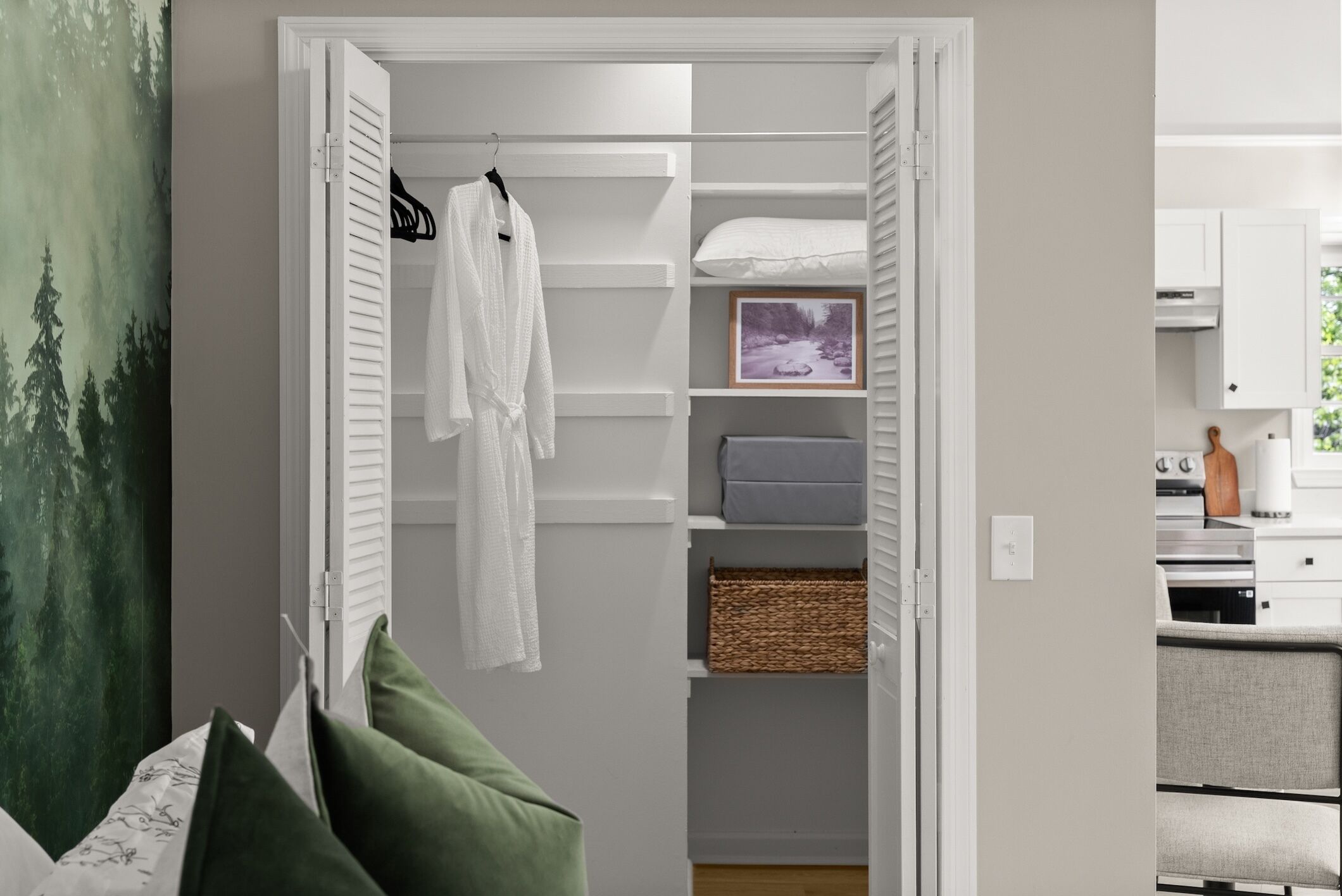 This spacious walk-in closet is stocked with plush towels, bathrobes, and an iron with an ironing board, ensuring you have everything you need during your stay. It’s the perfect place to unwind and enjoy the comfort of your private retreat.