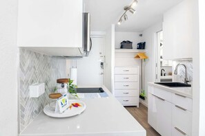 Fridge, microwave, stovetop, coffee/tea maker