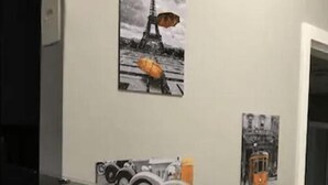 A wall with four black and white photographs of Paris landmarks, a telephone, and a power outlet. - Flat na rua Bela Cintra (São Paulo)
