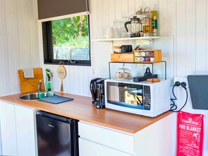 Fridge, microwave, stovetop, coffee/tea maker