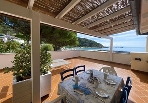Enjoy a romantic dinner for two on this outdoor terrace with breathtaking views of the beach and surrounding mountains.