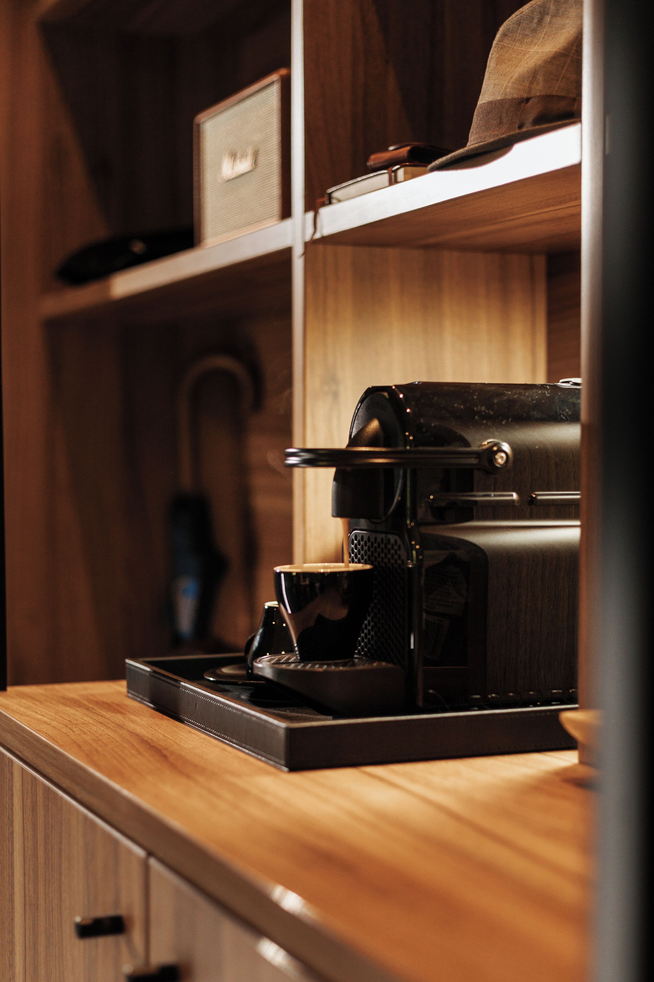 A kitchen with a coffee machine on the counter.
