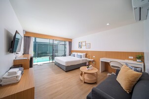 Premier Deluxe Pool Access | Pillowtop beds, in-room safe, individually decorated, desk