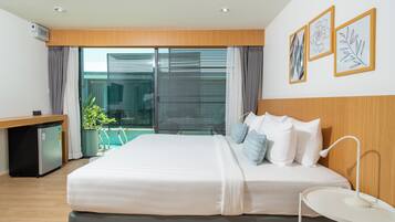 Premier Deluxe Pool Access | Pillowtop beds, in-room safe, individually decorated, desk