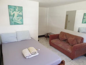 Deluxe Double Room | Laptop workspace, soundproofing, free WiFi, bed sheets - Casa Madrid (Maramag)