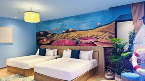A hotel room with two beds, a mural of an underwater scene, a chandelier, and a welcome sign. - Yellow Bee Resort Cililitan  (Jakarta)
