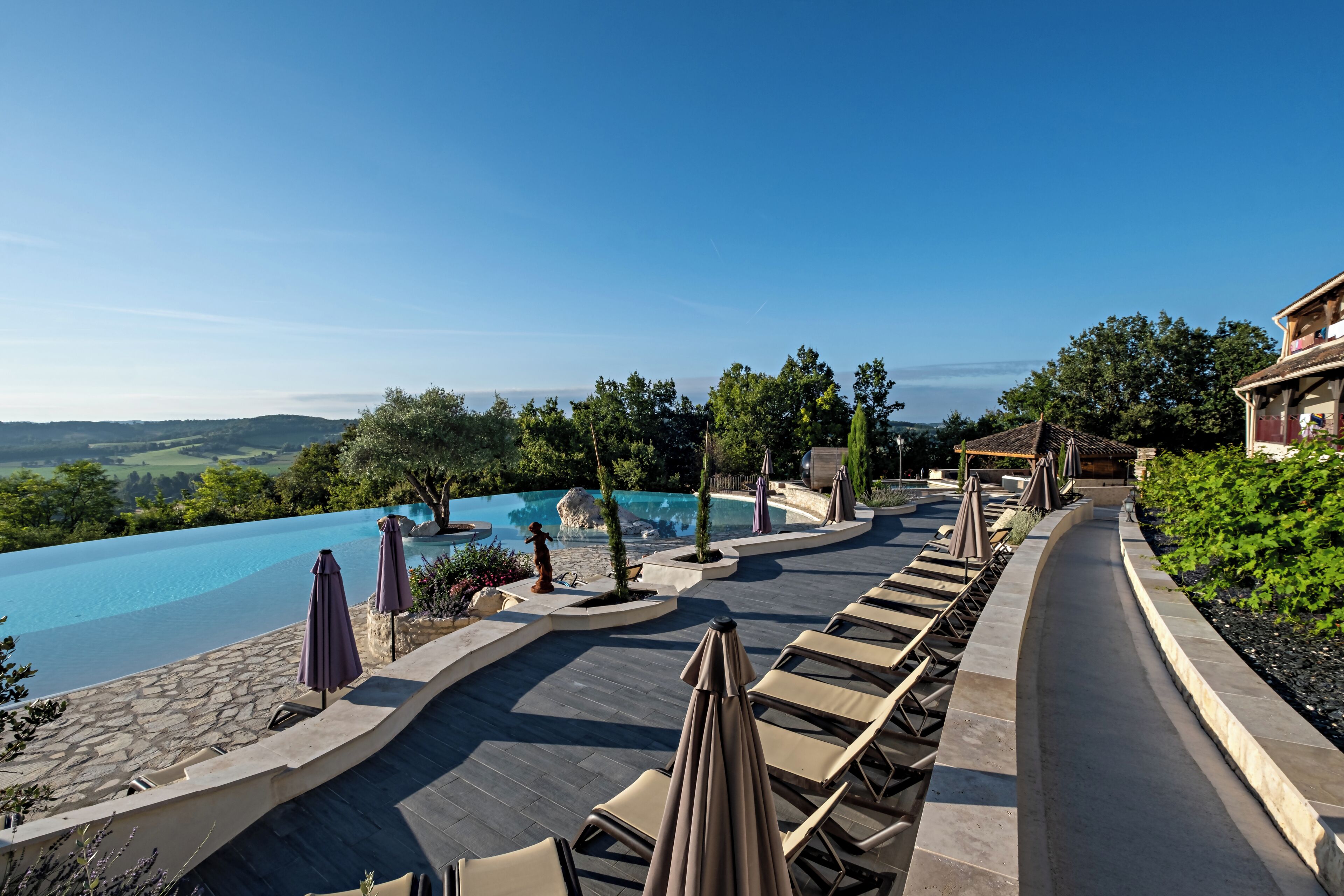 2 outdoor pools, pool umbrellas, pool loungers