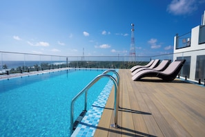 Outdoor pool, pool umbrellas, pool loungers