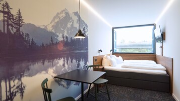 Habitación Confort doble | Ropa de cama de alta calidad y minibar con artículos gratuitos