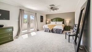 A bedroom with a bed, a nightstand, a dresser, a chair, a ceiling fan, and a window with curtains. - Spacious Villa 20 min to Strip & Airport!  Private Pool and amenities for all ages! (Las Vegas)