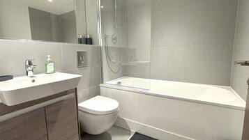 Shower, hair dryer, towels, shampoo