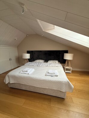 1 bedroom, desk, iron/ironing board, travel crib