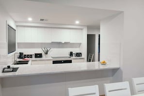 Coffee/tea maker, fridge, microwave, oven