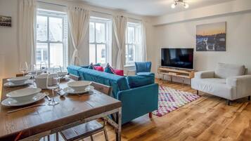 Apartment (2 Bedrooms) | Living area | 32-inch TV with cable channels