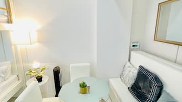 Basic Studio, Non Smoking, Balcony | Living area | 32-inch Smart TV with digital channels