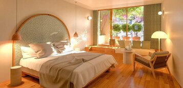 Un dormitorio moderno con una cama grande, un cabecero redondo, una pequeña zona de estar con sofá y sillones, y vistas al verdor a través de amplias ventanas.