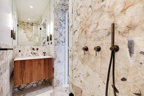 Shower, hair dryer, towels, shampoo