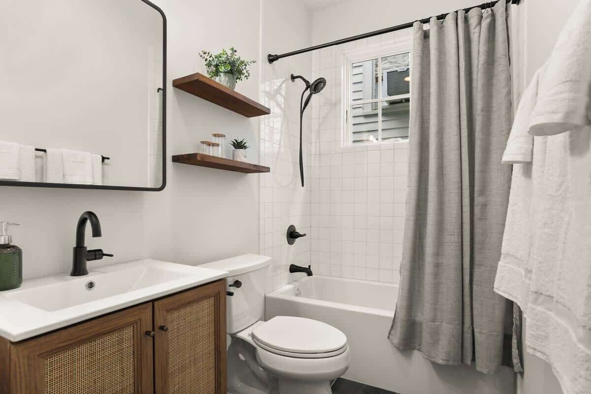 Shower, hair dryer, towels, shampoo
