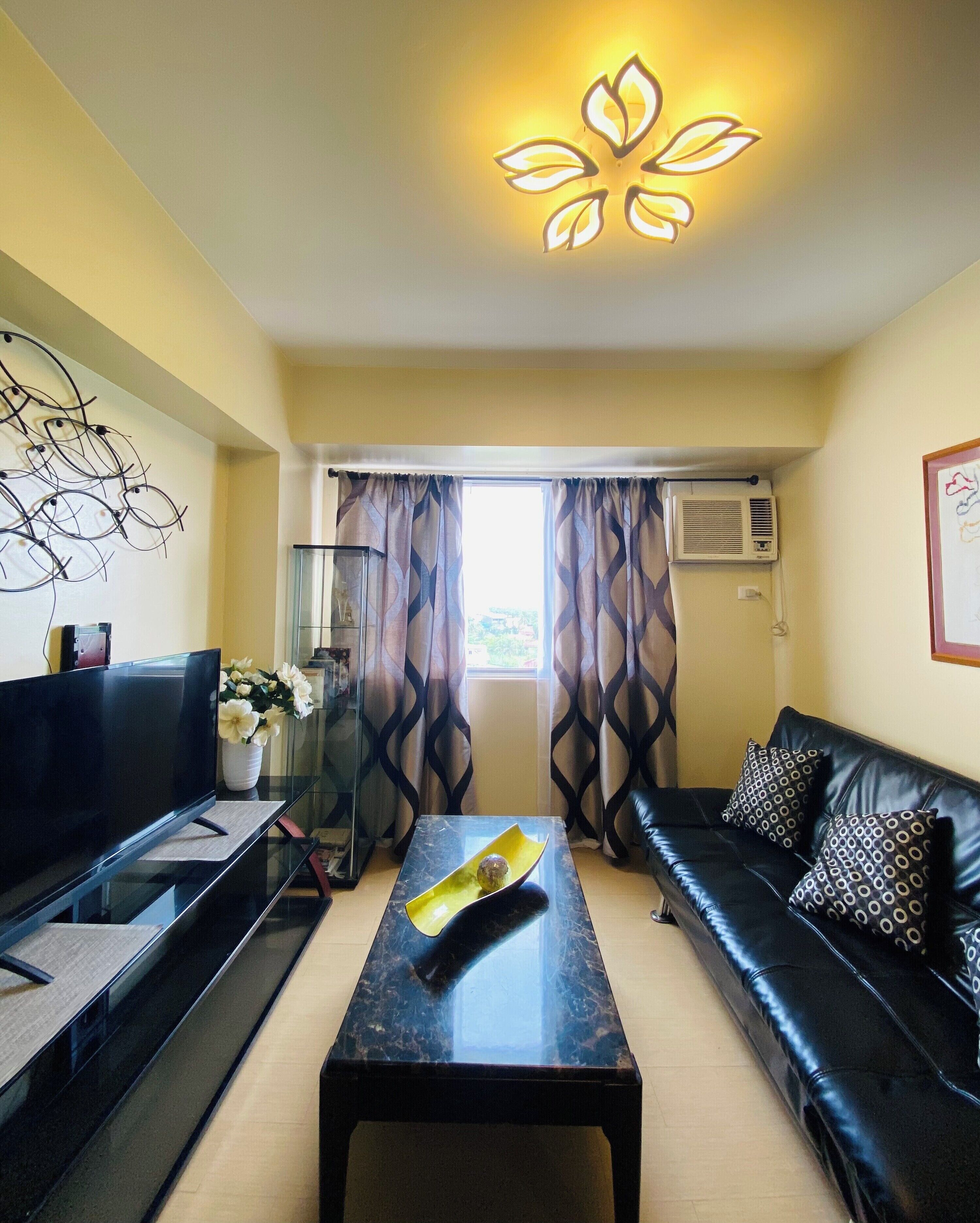 Family Condo, 1 Bedroom, Balcony, Poolside | Living room | 45-inch Smart TV with cable channels