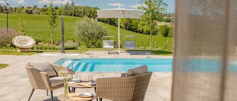 Seasonal outdoor pool, pool umbrellas, pool loungers