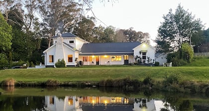 Modernized country house set in beautiful gardens with swimming pool.