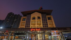 A hotel with a sign reading "HOTEL WESTERN" and "HOTEL WESTERN" in another language. - Hotel Western (Mumbai)