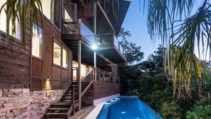 A modern house with a swimming pool, wooden exterior, and a balcony overlooking the pool. - Alang Alang, Alang Alang on Hamilton Island (Hamilton Island)