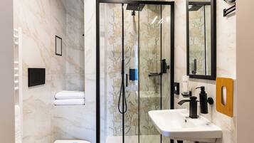 Deluxe Room, City View | Bathroom | Shower, hair dryer, slippers, towels
