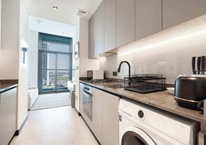 Fridge, microwave, stovetop, coffee/tea maker