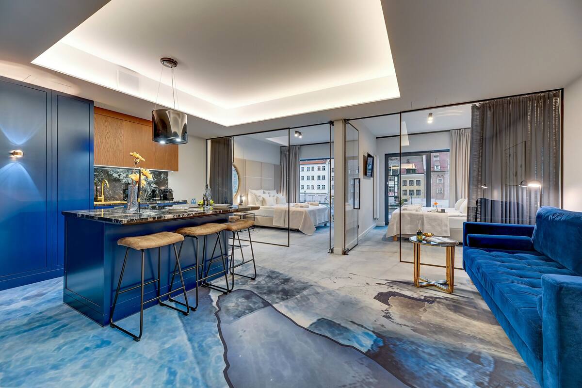 A modern interior with a kitchen, dining area, and living room.