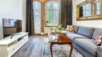 Apartamento | Sala de estar | Una televisión de pantalla plana