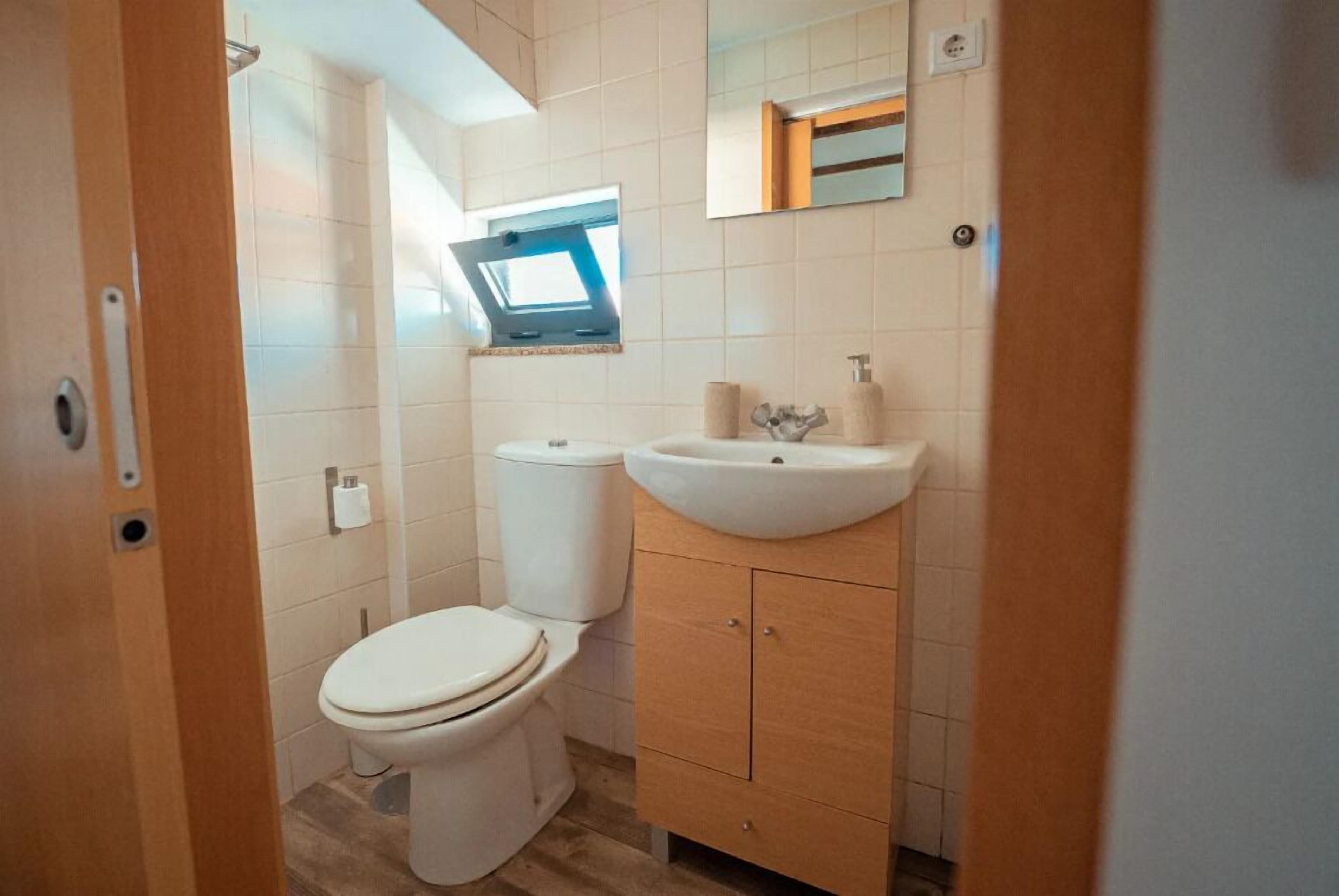 Separate bathtub and shower, hair dryer, towels, soap