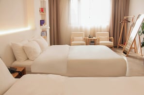 Habitació amb dos llits individuals superior | Roba de llit d'alta qualitat i matalassos d'escuma viscoelàstica