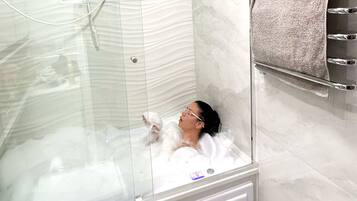 Jetted bath, hair dryer, towels, soap