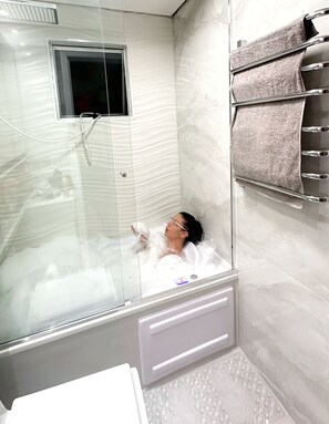 Jetted tub, hair dryer, towels, soap