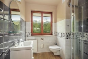 Shower, hair dryer, bathrobes, towels