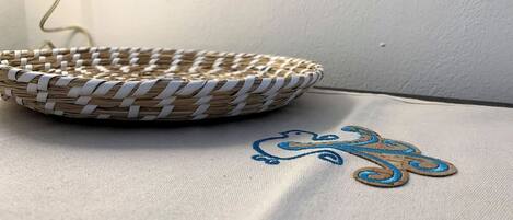 A woven basket on a fabric surface.