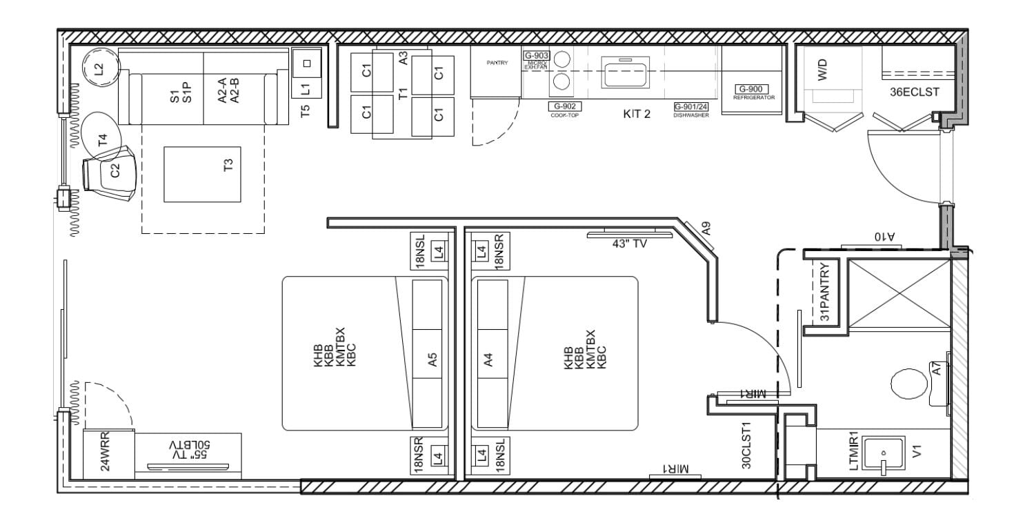 Un plan d’étage d’un hôtel comprenant plusieurs chambres, un espace cuisine et un espace repas.