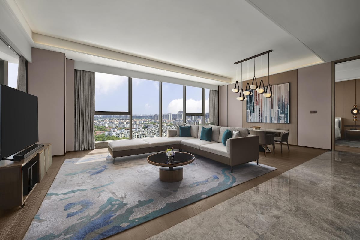 King Ambassador Suite | Living area | 50-inch TV with cable channels