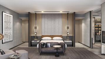 A modern hotel room with a large bed, two bedside tables, a seating area, and a minibar.